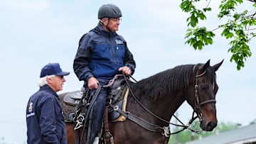 Trainer Bob Baffert talks with trainer Bill Mott on the backside Friday morning at Churchill Downs in Louisville, Kentucky. Baffert returned to Churchill Downs for the 2025 Kentucky Derby after a three-year suspension. Baffert has two horses, Citizen Bull and Rodriguez, in this year's Kentucky Derby. April 25, 2025.