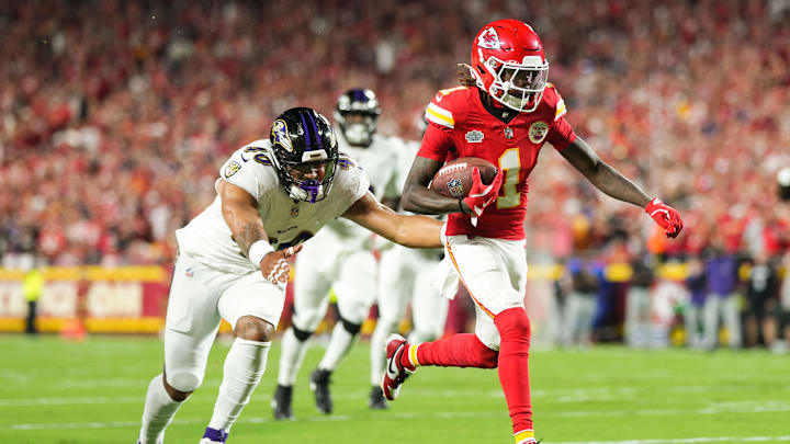 Sep 5, 2024; Kansas City, Missouri, USA; Kansas City Chiefs wide receiver Xavier Worthy (1) scores a touchdown against Baltimore Ravens linebacker Malik Harrison (40) during the first half at GEHA Field at Arrowhead Stadium. Mandatory Credit: Jay Biggerstaff-Imagn Images