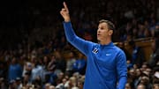 Nov 14, 2025; Durham, North Carolina, USA; Duke Blue Devils head coach Jon Scheyer directs his team during the second half against the Indiana State Sycamores at Cameron Indoor Stadium. Mandatory Credit: Rob Kinnan-Imagn Images
