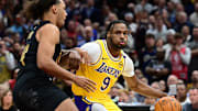 Oct 30, 2024; Cleveland, Ohio, USA; Los Angeles Lakers guard Bronny James (9) drives to the basket against  Cleveland Cavaliers forward Jaylon Tyson (24) during the second half at Rocket Mortgage FieldHouse. Mandatory Credit: Ken Blaze-Imagn Images
