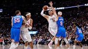 Denver Nuggets center Nikola Jokic (15) looks to pass the ball under pressure from Oklahoma City Thunder guard Alex Caruso (9) as center Isaiah Hartenstein (55) and forward Aaron Gordon (32) battle for position in the third quarter during game six of the second round for the 2025 NBA Playoffs at Ball Arena. 