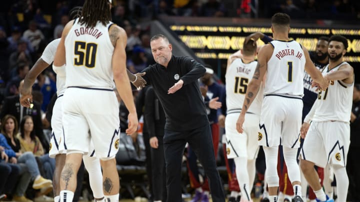 Feb 25, 2024; San Francisco, California, USA; Denver Nuggets head coach Michael Malone congratulates his players as they come off the court during the fourth quarter against the Golden State Warriors at Chase Center.