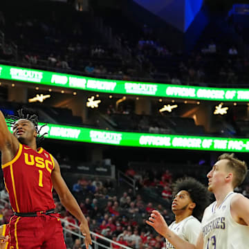 Mar 13, 2024; Las Vegas, NV, USA; USC Trojans guard Isaiah Collier (1) shoots over Washington Huskies forward Wilhelm Breidenbach (32) during the second half at T-Mobile Arena. Mandatory Credit: Stephen R. Sylvanie-Imagn Images