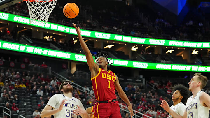 Mar 13, 2024; Las Vegas, NV, USA; USC Trojans guard Isaiah Collier (1) shoots over Washington Huskies forward Wilhelm Breidenbach (32) during the second half at T-Mobile Arena. Mandatory Credit: Stephen R. Sylvanie-Imagn Images