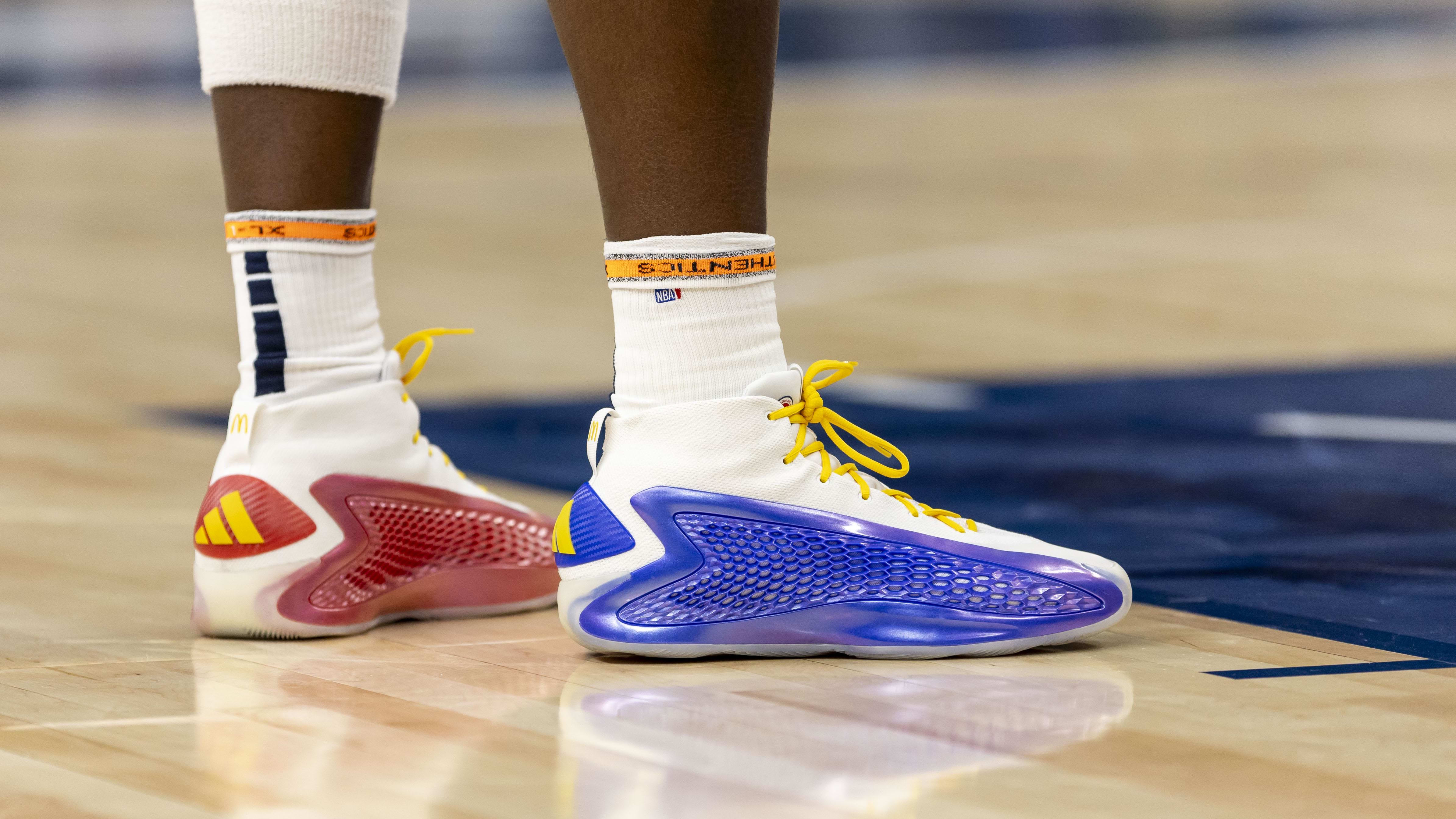 Minnesota Timberwolves guard Anthony Edwards' blue and red adidas sneakers.