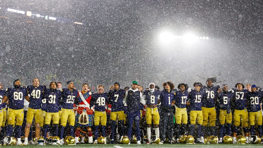 Notre Dame head coach Marcus Freeman celebrates with his players
