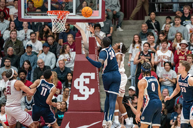 Santa Clara Broncos forward Elijah Mahi (8) shoots the basketball against Gonzaga Bulldogs center Ismaila Diagne (24). 