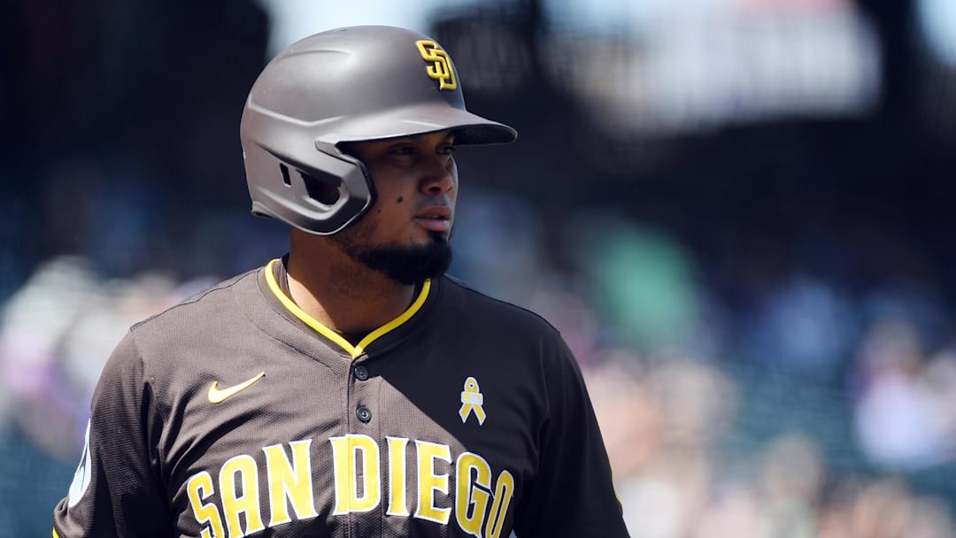 Sep 7, 2025; Denver, Colorado, USA; San Diego Padres first base Luis Arraez (4) waits for his at bat during the first inning against the Colorado Rockies at Coors Field. Mandatory Credit: Christopher Hanewinckel-Imagn Images