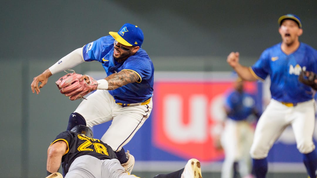 Jul 11, 2025; Minneapolis, Minnesota, USA; Pittsburgh Pirates left fielder Tommy Pham (28) slide into second base as Minnesota Twins shortstop Carlos Correa (4) tags him out but leaves the game injured in the seventh inning at Target Field. Mandatory Credit: Matt Blewett-Imagn Images