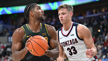 Nov 4, 2024; Spokane, Washington, USA; Baylor Bears forward Norchad Omier (15) shoots the ball against Gonzaga Bulldogs forward Ben Gregg (33) in the second half at Spokane Arena. Mandatory Credit: James Snook-Imagn Images