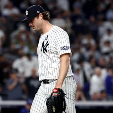 Oct 30, 2024; New York, New York, USA; New York Yankees pitcher Gerrit Cole (45) reacts after a play during the fifth inning against the Los Angeles Dodgers in game five of the 2024 MLB World Series at Yankee Stadium. Mandatory Credit: Vincent Carchietta-Imagn Images