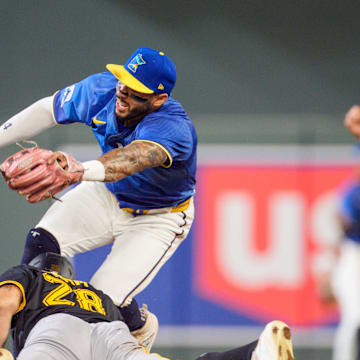 Jul 11, 2025; Minneapolis, Minnesota, USA; Pittsburgh Pirates left fielder Tommy Pham (28) slide into second base as Minnesota Twins shortstop Carlos Correa (4) tags him out but leaves the game injured in the seventh inning at Target Field. Mandatory Credit: Matt Blewett-Imagn Images