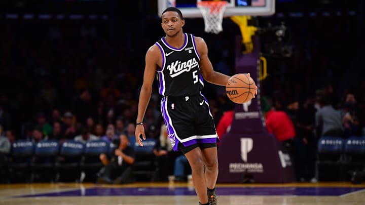Mar 6, 2024; Los Angeles, California, USA;  Sacramento Kings guard De’Aaron Fox (5) controls the ball against the against the Los Angeles Lakers during the first half at Crypto.com Arena. Mandatory Credit: Gary A. Vasquez-Imagn Images