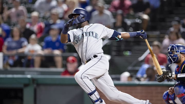 Seattle Mariners left fielder Guillermo Heredia (5) hits a single during the third inning against the Texas Rangers in Arlington in 2018.