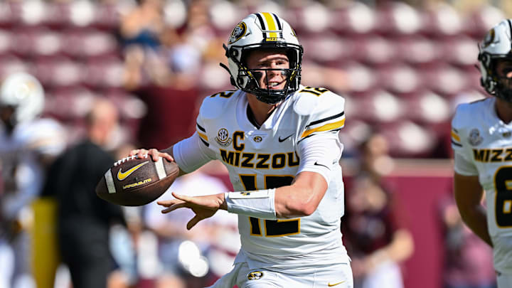 Oct 5, 2024; College Station, Texas, USA; Missouri Tigers quarterback Brady Cook (12) warms up prior to the game against the Texas A&M Aggies at Kyle Field. Mandatory Credit: Maria Lysaker-Imagn Images. 