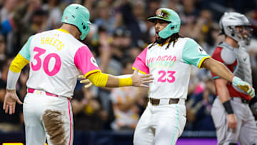 Sep 26, 2025; San Diego, California, USA; San Diego Padres right fielder Fernando Tatis Jr. (23) celebrates with left fielder Gavin Sheets (30) after hitting a grand slam home run during the fourth inning Arizona Diamondbacks at Petco Park. Mandatory Credit: David Frerker-Imagn Images