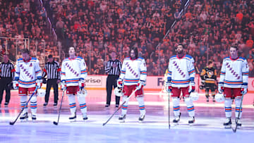 Feb 23, 2025; Pittsburgh, Pennsylvania, USA;  New York Rangers starting lineup (L to R) right wing Artemi Panarin (10) and left wing J.T. Miller (8) and center Mika Zibanejad (93) and defensemen K'Andre Miller (79) and Will Borgen (17) stand for the national anthem against the Pittsburgh Penguins at PPG Paints Arena. Mandatory Credit: Charles LeClaire-Imagn Images