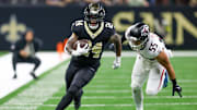 Nov 23, 2025; New Orleans, Louisiana, USA; New Orleans Saints running back Devin Neal (24) carries the ball as Atlanta Falcons linebacker Kaden Elliss (55) defends during the second half at Caesars Superdome. Mandatory Credit: Stephen Lew-Imagn Images