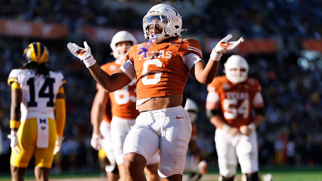 Texas Longhorns running back Christian Clark gestures after scoring a touchdown against the Michigan Wolverines