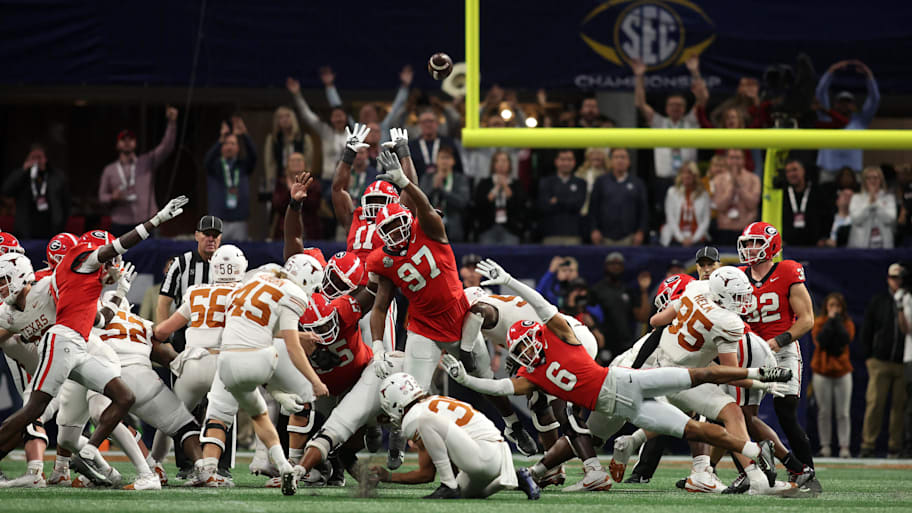 Longhorns place kicker Bert Auburn kicks the game tying field goal 