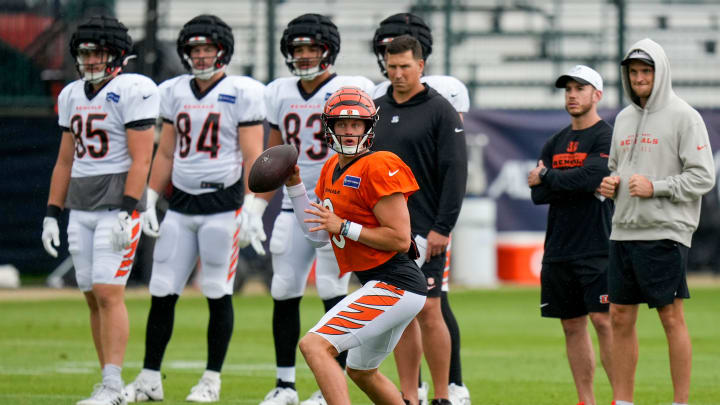 Cincinnati Bengals quarterback Joe Burrow (9) runs a play at the Chicago Bears Halas Hall practice facility in Lake Forest, Ill., on Thursday, Aug. 15, 2024.