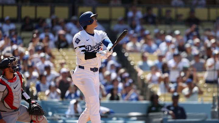 Los Angeles, California, USA; Los Angeles Dodgers two-way player Shohei Ohtani (17) hits a two-run home run during the eighth inning against the Washington Nationals at Dodger Stadium. Los Angeles, California, USA; Los Angeles Dodgers two-way player Shohei Ohtani (17) hits a two-run home run during the eighth inning against the Washington Nationals at Dodger Stadium.