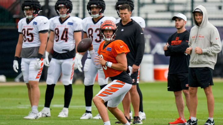 Cincinnati Bengals quarterback Joe Burrow (9) runs a play at the Chicago Bears Halas Hall practice facility in Lake Forest, Ill., on Thursday, Aug. 15, 2024.