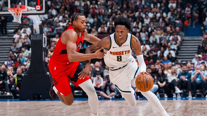 Oct 6, 2025; Vancouver, British Columbia, CAN; Denver Nuggets guard Peyton Watson (8) drives past Toronto Raptors guard Scottie Barnes (4) in the second half at Rogers Arena. Mandatory Credit: Bob Frid-Imagn Images