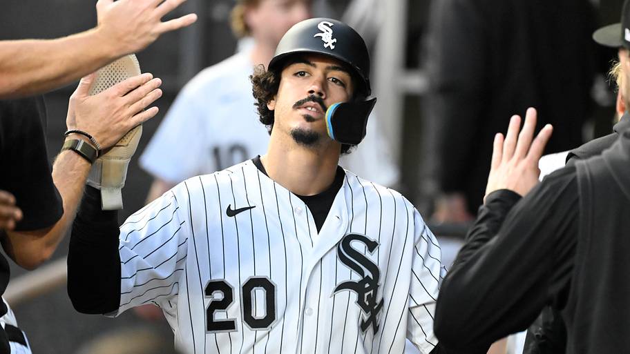 Chicago White Sox third baseman Miguel Vargas (20) celebrates in the dugout 