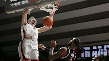 Jan 24, 2024; Tuscaloosa, Alabama, USA; Alabama Crimson Tide forward Grant Nelson (2) makes a dunk late in the game over Auburn Tigers center Johni Broome (4) at Coleman Coliseum. Mandatory Credit: Gary Cosby Jr.-Imagn Images