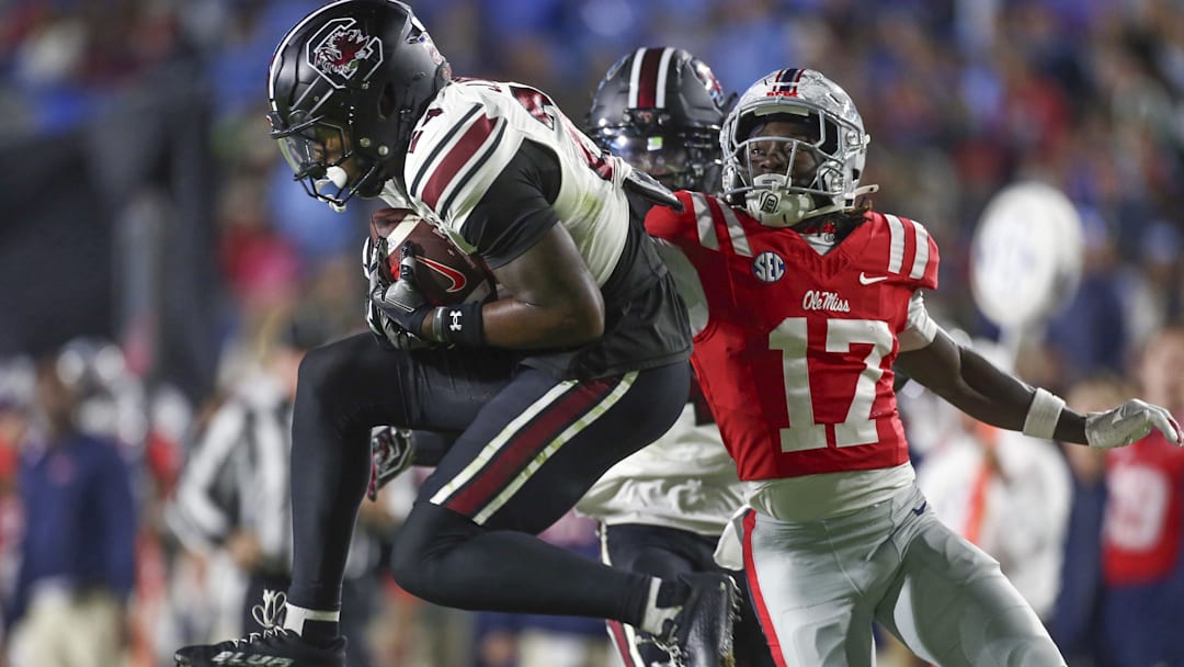 Nov 1, 2025; Oxford, Mississippi, USA; South Carolina Gamecocks defensive back Jalon Kilgore (24) intercepts a pass intended for Mississippi Rebels wide receiver Winston Watkins (17) during the second quarter at Vaught-Hemingway Stadium. Mandatory Credit: Petre Thomas-Imagn Images