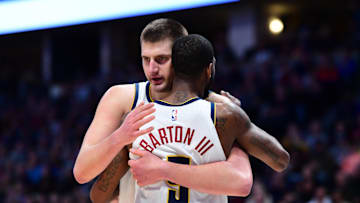 Dec 28, 2019; Denver, Colorado, USA; Denver Nuggets center Nikola Jokic (15) and Denver Nuggets guard Will Barton (5) celebrate a score in the second half against the Memphis Grizzlies at the Pepsi Center. Mandatory Credit: Ron Chenoy-Imagn Images