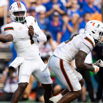 Aug 31, 2024; Gainesville, Florida, USA;  Miami Hurricanes quarterback Cam Ward (1) throws the ball against the Florida Gators during the second half at Ben Hill Griffin Stadium. Mandatory Credit: Matt Pendleton-USA TODAY Sports