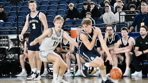 Jake Willis tries to get loose on a drive for Arlington in WIAA showdown with 4A Wesco rival Glacier Peak on Wednesday.