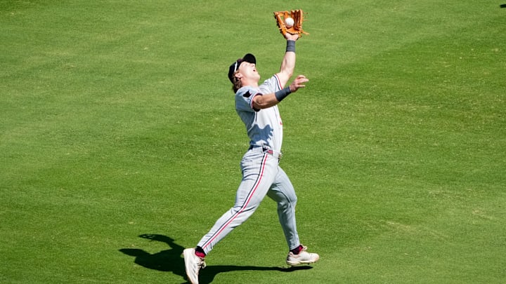 Sep 7, 2025; Kansas City, Missouri, USA; Minnesota Twins second baseman Luke Keaschall (15) fields a fly ball against the Kansas City Royals during the third inning at Kauffman Stadium. Mandatory Credit: Denny Medley-Imagn Images