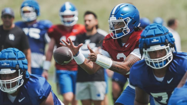 Kentucky quarterback Gavin WImsatt (2) takes a snap during practice Friday. August 2, 2024 in Lexington.