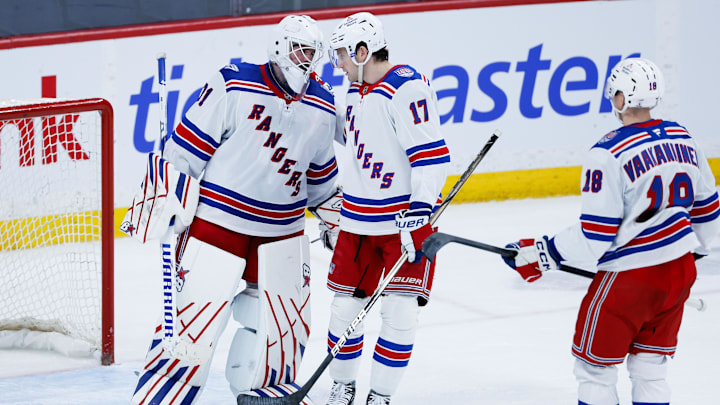 Mar 12, 2026; Winnipeg, Manitoba, CAN; New York Rangers goalie Igor Shesterkin (31) is congratulated by defenseman Will Borgen (17) on his win against the Winnipeg Jets at the end of the third period at Canada Life Centre.