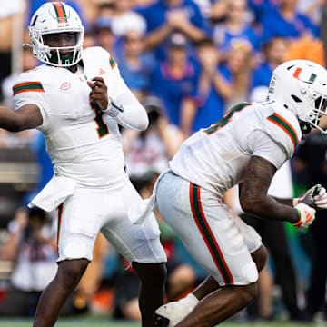 Aug 31, 2024; Gainesville, Florida, USA;  Miami Hurricanes quarterback Cam Ward (1) throws the ball against the Florida Gators during the second half at Ben Hill Griffin Stadium