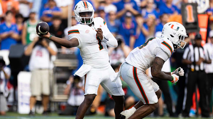 Aug 31, 2024; Gainesville, Florida, USA;  Miami Hurricanes quarterback Cam Ward (1) throws the ball against the Florida Gators during the second half at Ben Hill Griffin Stadium