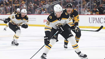 Apr 13, 2025; Pittsburgh, Pennsylvania, USA; Boston Bruins center Morgan Geekie (39) skates with the puck against the Pittsburgh Penguins during the second period at PPG Paints Arena. Mandatory Credit: Charles LeClaire-Imagn Images