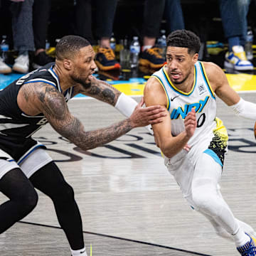 Apr 22, 2025; Indianapolis, Indiana, USA; Indiana Pacers guard Tyrese Haliburton (0) dribbles the ball while Milwaukee Bucks guard Damian Lillard (0) defends during game two of first round for the 2024 NBA Playoffs at Gainbridge Fieldhouse. Mandatory Credit: Trevor Ruszkowski-Imagn Images