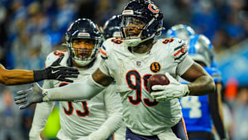 Gervon Dexter celebrates after coming up with a fumble against the Lions. His positional situation could be clarified soon.