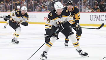 Apr 13, 2025; Pittsburgh, Pennsylvania, USA; Boston Bruins center Morgan Geekie (39) skates with the puck against the Pittsburgh Penguins during the second period at PPG Paints Arena. Mandatory Credit: Charles LeClaire-Imagn Images