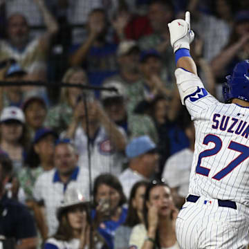Chicago, Illinois, USA; Chicago Cubs outfielder Seiya Suzuki (27) points after hitting a home run against the St. Louis Cardinals during the fifth inning at Wrigley Field.