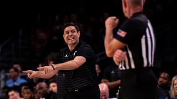 Cincinnati Bearcats head coach Wes Miller speaks to a referee in the second half of the NCAA Basketball game at Fifth Third Arena in Cincinnati on Saturday, Dec. 14, 2024. Cincinnati Bearcats defeated Xavier Musketeers 68-65.