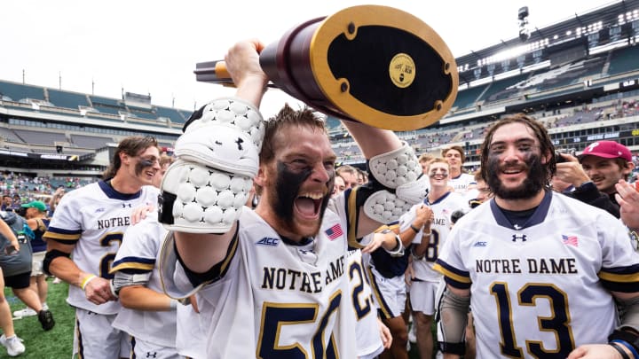 May 27, 2024; Philadelphia, PA, USA; Notre Dame fighting Irish attack Chris Kavanagh (50) celebrates with the Lacrosse championship trophy after a victory against the Maryland Terrapins at Lincoln Financial Field. 