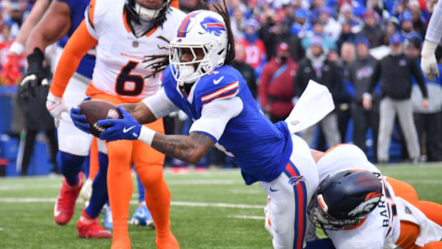 Jan 12, 2025; Orchard Park, New York, USA; Buffalo Bills running back James Cook (4) dives for a touchdown as Denver Broncos 