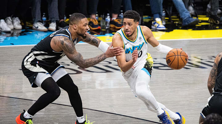 Indiana Pacers guard Tyrese Haliburton (0) dribbles the ball while Milwaukee Bucks guard Damian Lillard (0) defends during game two of first round for the 2024 NBA Playoffs at Gainbridge Fieldhouse. Indiana Pacers guard Tyrese Haliburton (0) dribbles the ball while Milwaukee Bucks guard Damian Lillard (0) defends during game two of first round for the 2024 NBA Playoffs at Gainbridge Fieldhouse.