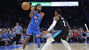 Nov 23, 2025; Oklahoma City, Oklahoma, USA; Oklahoma City Thunder guard Isaiah Joe (11) passes the ball beside Portland Trail Blazers guard Caleb Love (2) during the second half at Paycom Center. Mandatory Credit: Alonzo Adams-Imagn Images