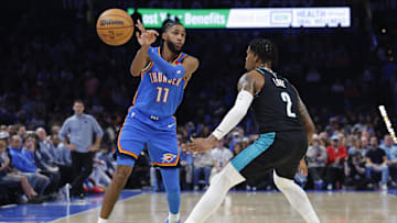 Nov 23, 2025; Oklahoma City, Oklahoma, USA; Oklahoma City Thunder guard Isaiah Joe (11) passes the ball beside Portland Trail Blazers guard Caleb Love (2) during the second half at Paycom Center. Mandatory Credit: Alonzo Adams-Imagn Images